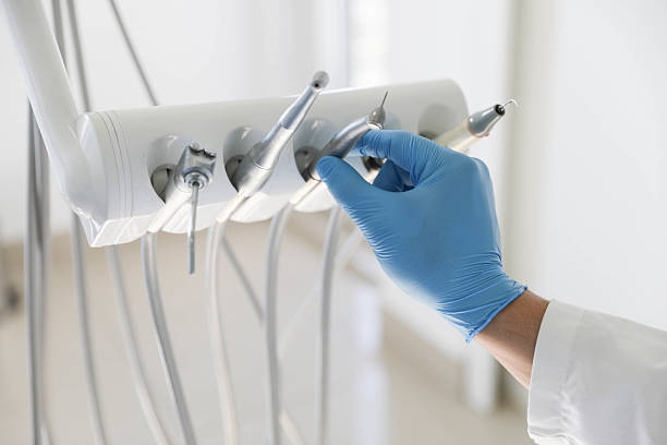Professional Tooth Extraction technician working in Lafayette, LA